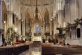 Of St Patrick's Cathedral in New York City, featuring large wooden pews and floral decorations Royalty Free Stock Photo