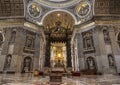 The interior of St. Peter`s Basilica in the Vatican. Baroque canopy over the altar, above the canopy rises a Department dedicated