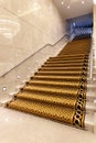Interior stairs with golden yellow carpet Royalty Free Stock Photo