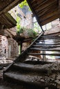 Interior with stairs of an old burned down abandoned house Royalty Free Stock Photo