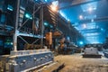 Interior of steel mill. Workers in workshop of metallurgical plant. Foundry and heavy industry building inside Royalty Free Stock Photo