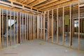 Interior stick built frame of a unfinished basement new house under construction Royalty Free Stock Photo