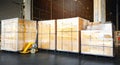 Interior of storage warehouse, stack of package boxes on pallets