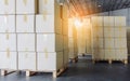 Interior of Storage Warehouse. Stacked of Package Boxes on Wooden Pallet in The Warehouse. Shipment Boxes. Cargo Export- Import. Royalty Free Stock Photo