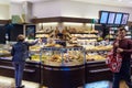 The interior of the store with a large selection of bread, rolls