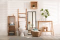 Interior of bathroom with toilet bowl and decor elements