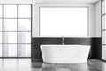 White and gray bathroom with tub and poster Royalty Free Stock Photo
