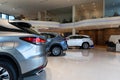 the interior of a stylish modern car dealership with new premium SUVs