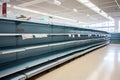 Interior of a supermarket with rows of empty shelves for food products, Food shortage in a generic supermarket, with empty shelves