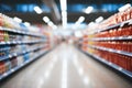 Interior of a supermarket store aisle with an abstract blurred backdrop Royalty Free Stock Photo