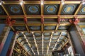 Interior of Tea house on Myasnitskaya. Coffered ceiling decorated with ornaments with gold and light bulbs. Moscow,