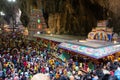 Interior temple at Batu Caves and devotees at Thaipusam Festival