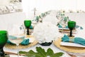 Interior of tent for wedding diner, ready for guests. Served round banquet table outdoor in marquee decorated hydrangea Royalty Free Stock Photo