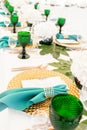 Interior of tent for wedding diner, ready for guests. Served round banquet table outdoor in marquee decorated hydrangea Royalty Free Stock Photo