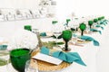 Interior of tent for wedding diner, ready for guests. Served round banquet table outdoor in marquee decorated hydrangea Royalty Free Stock Photo