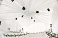 Interior of tent for wedding diner, ready for guests. Served round banquet table outdoor in marquee decorated hydrangea Royalty Free Stock Photo