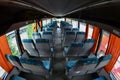 Interior of the tourist bus for excursions and long trips. A lot of free seats and places for small luggage