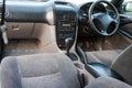 Interior of Toyota Caldina car of 2000 release in the back of a silver T210 station wagon with front seats, dashboard and steering