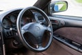 Interior of Toyota Caldina car of 2000 release in the back of a silver T210 station wagon with steering wheel and dashboard in a