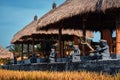 Interior of a traditional Balinese cafe in a rice field.