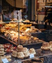 interior of traditional French bakery selling croissants bread cakes