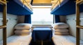 Interior of a Train Compartment with Bunk Beds and a Small Table sleeping Royalty Free Stock Photo