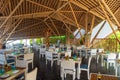 Interior of tropical restaurant with tables and chairs Royalty Free Stock Photo