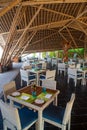 Interior of tropical restaurant with tables and chairs at luxury five stars resort Royalty Free Stock Photo