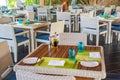 Interior of tropical restaurant with wooden tables and chairs at luxury five stars resort Royalty Free Stock Photo