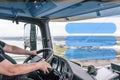 Interior of a truck cab with a driver while driving. Template ready for your use Royalty Free Stock Photo