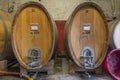 The interior of a Tuscan cellar with large wooden barrels for aging red wine