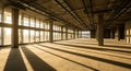 Unfinished concrete building interior with large windows and dramatic sunlight shadows construction Royalty Free Stock Photo