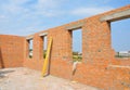 Interior of a unfinished red brick house under construction. Royalty Free Stock Photo