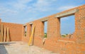 Interior of a Unfinished Red Brick House Walls under Construction without Roofing Royalty Free Stock Photo