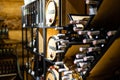 Interior of very old wine cellar with vintage wine pump and dried meat delicatessen.