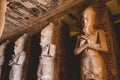 Interior View with an Ancient Egyptian Statues of Ramesses linked to the god Osiris in the Great Temple at Abu Simbel Royalty Free Stock Photo