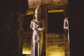 Interior View with an Ancient Egyptian Statues of Ramesses linked to the god Osiris in the Great Temple at Abu Simbel Royalty Free Stock Photo