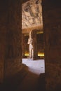 Interior View with an Ancient Egyptian Statues of Ramesses linked to the god Osiris in the Great Temple at Abu Simbel Royalty Free Stock Photo