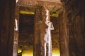 Interior View with an Ancient Egyptian Statues of Ramesses linked to the god Osiris in the Great Temple at Abu Simbel Royalty Free Stock Photo