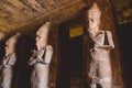 Interior View with an Ancient Egyptian Statues of Ramesses linked to the god Osiris in the Great Temple at Abu Simbel Royalty Free Stock Photo