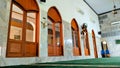 Interior View of Arched Mosque Windows and Marble Tiled Walls Royalty Free Stock Photo