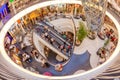 interior view of atrium and escalator hall with curvature corridor of Myzeil, modern shopping mall in Frankfurt