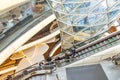 interior view of atrium and escalator hall with fascinate curvature corridor of Myzeil, designed shopping mall