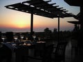 Interior view of the bar-restaurant at sunset. Sea and beautiful sunset. The image of the open terrace of the restaurant