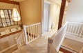 Interior View Of Beautiful Stairs And Landing With Exposed Wooden Beams In Family House Royalty Free Stock Photo