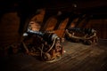Interior view of Cannons At The Deck and Cannon Balls plus windows on old galleon with ropes Royalty Free Stock Photo