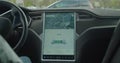 Interior view of a caucasian man using Autopilot in a electric vehicle, Tesla Model S. Royalty Free Stock Photo