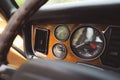 Interior view of a classic car, featuring a dashboard with a variety of dials and gauges Royalty Free Stock Photo