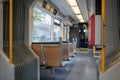 Interior view of a corridor inside passenger trains with blue fabric seats of German railway train system. Royalty Free Stock Photo