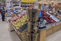 Interior view of fruits and vegetables department of ICA supermarket. Paper bags stand on front.